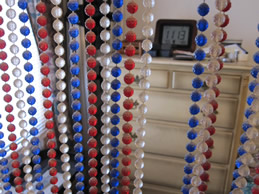 Beaded curtan and clothes dresser