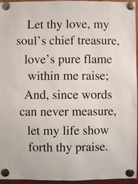 Hymn verse tacked to door